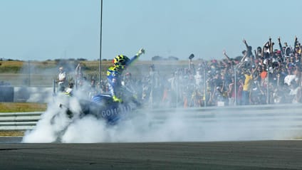 Valentino Rossi celebrates 2004 South Africa GP win over Max Biaggi