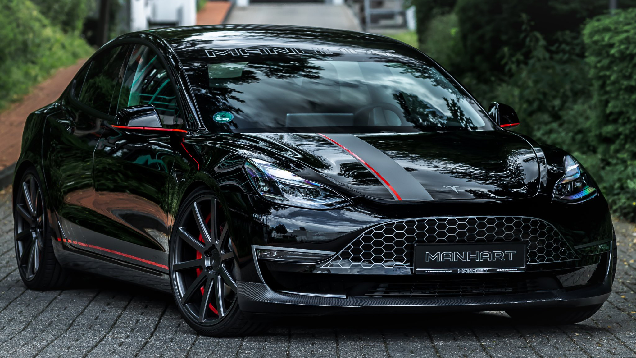 Manhart has painted a grille onto the Tesla Model 3