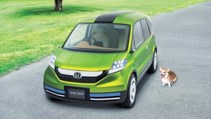 Honda WOW concept with dog sitting next to it