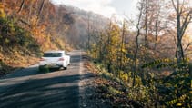 Genesis G70 Shooting Brake rear end driving up a hill