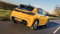 Rear driving shot of the Peugeot 208 on a country road