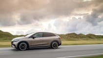 Profile driving shot of Mercedes Benz EQE SUV