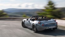 Driving shot from rear of Weismann Thunderbolt on mountainous curve