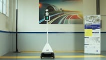 Robot which has a mobile pedestrian crossing images displayed on screen