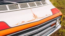 A 1977 Dodge Tradesman camper van bonnet close up
