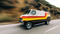 Driving shot of a 1977 Dodge Tradesman side profile driving shot