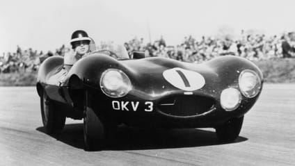 Jaguar D-Type being raced out on track at Le Mans