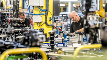 Line workers assemble components at Stellantis' Ellesmere Port EV plant