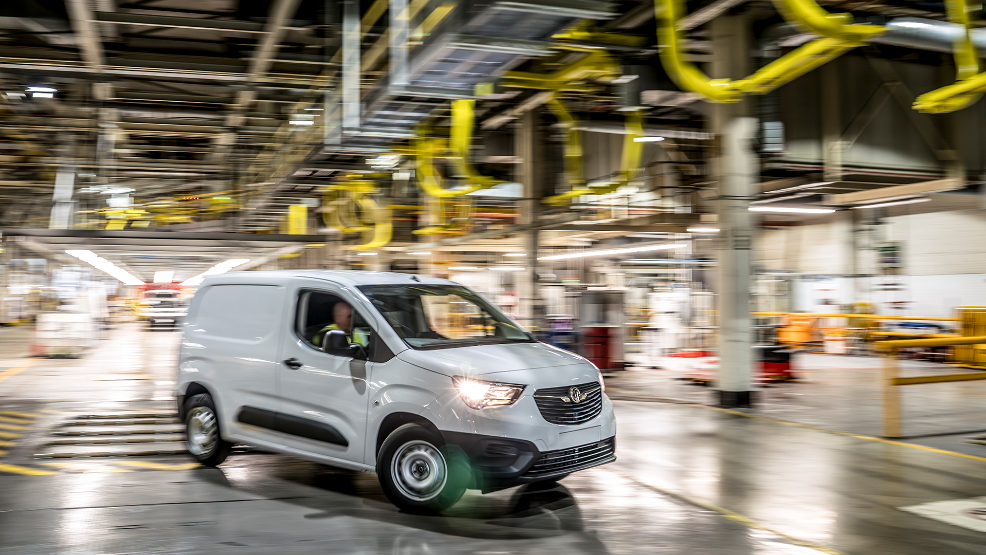 Finished electric van driving off line at Ellesmere Port