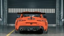 Static garage shot of Toyota GR Supra GT4 100 Edition, rear dead-on