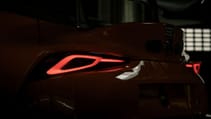 Static garage shot of Toyota GR Supra GT4 100 Edition, in dark showing rear lights on