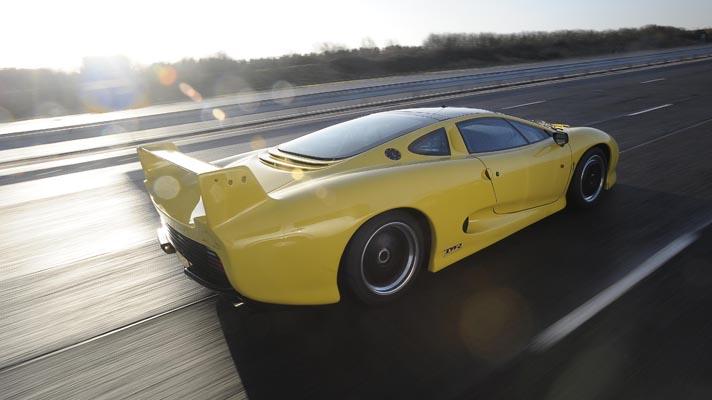 Rear driving shot of the Jaguar XJ220 on track