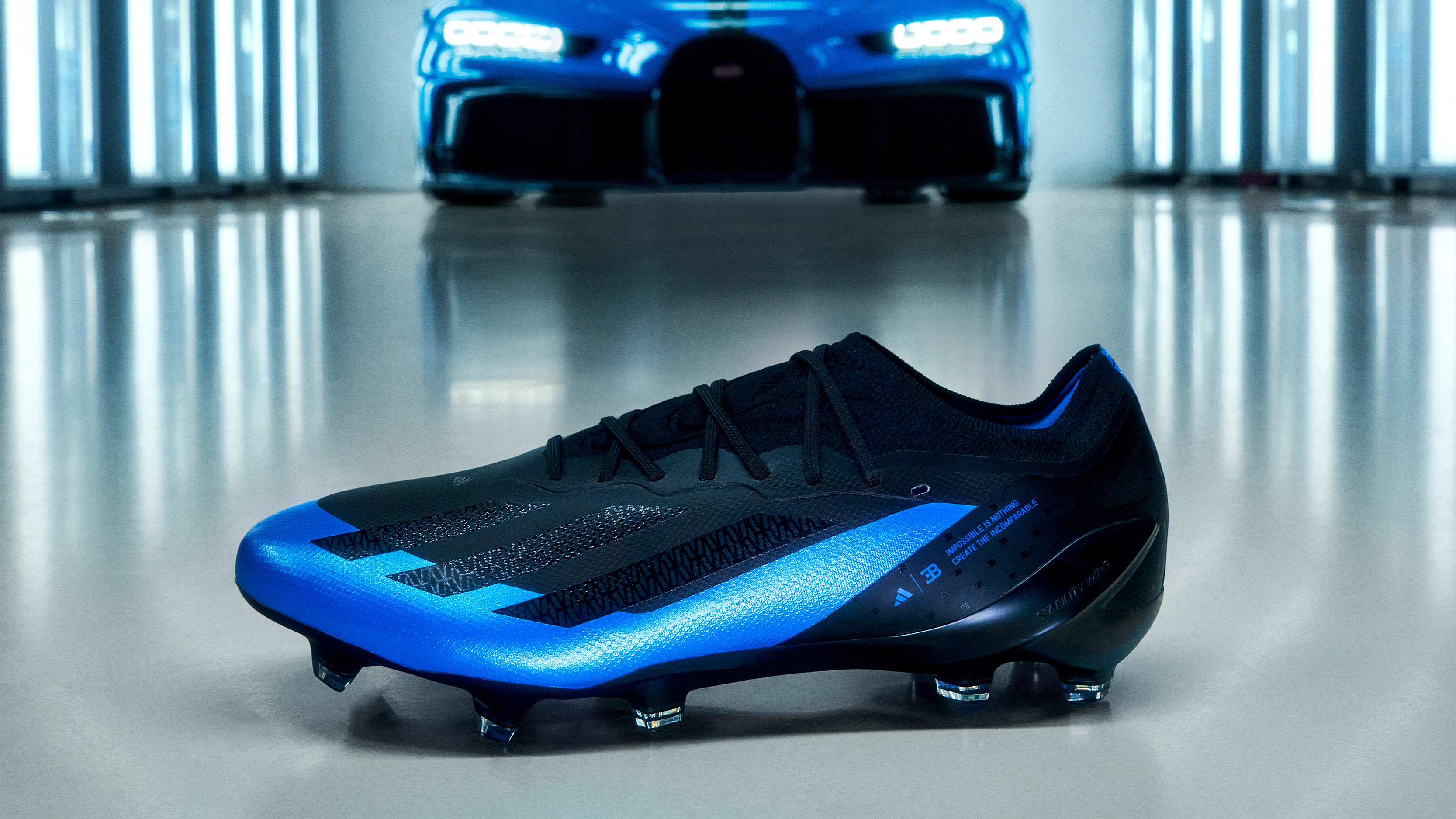 black and blue adidas boots