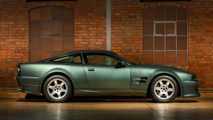 Side profile static shot of a green Aston Martin V8 Vantage V550