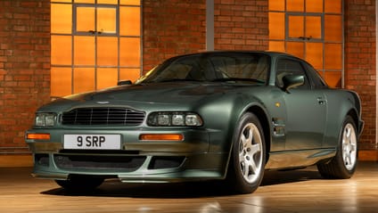Front three quarter static shot of a green Aston Martin V8 Vantage V550
