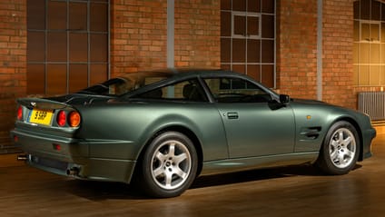 Rear three quarter static shot of a green Aston Martin V8 Vantage V550