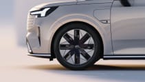 Side profile shot zoomed on wheel of Volvo EM90