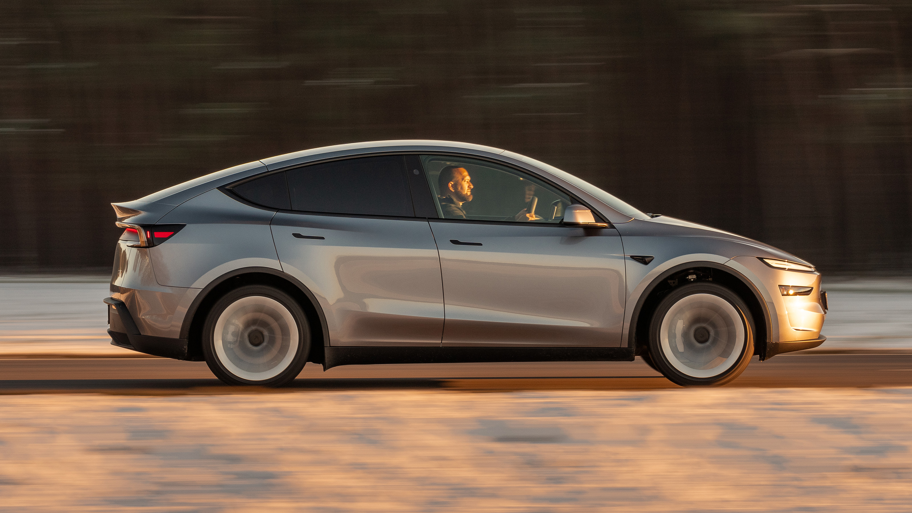 Tesla Model Y profile Tom Ford driving