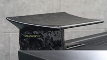 Exterior shot of Mansory Elongation, side of the split rear wing showing Mansory moniker