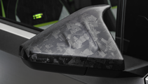 Exterior shot of Mansory Elongation, showing carbon fibre backed wing mirror