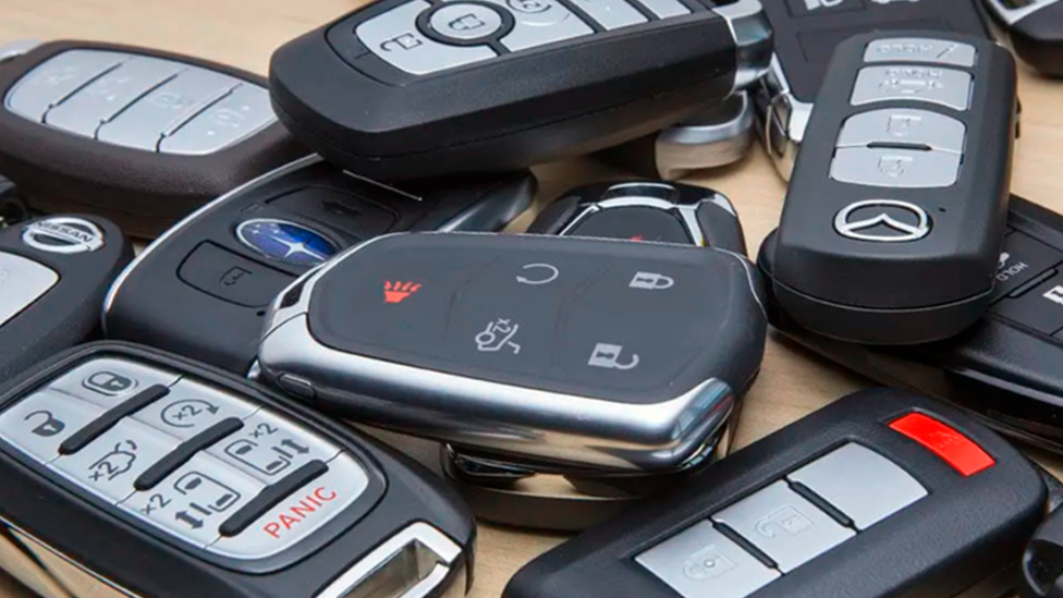 Group of key fobs for various brands of cars
