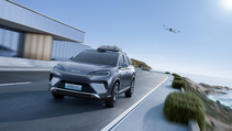 High angled driving shot of Lingyuan vehicle-mounted drone system on the roof of BYD Sealion, with drone flying and following