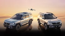 BYD Leopard 8 Drone Edition sits with LingYuan vehicle-mounted drone system and DJI Mavic 3 drone hovering about with graphic-rendered sunset background