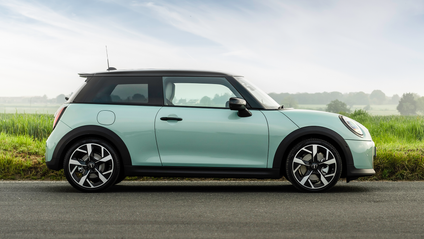 Side profile driving shot of Mini Cooper