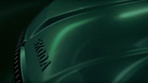 A shadowed teaser image of Skoda Vision 7S, close up of bonnet