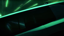 A shadowed teaser image of Skoda Vision 7S, from side on an angle