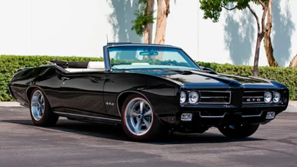 A static three-quarter front shot of a 1968 Pontiac GTO owned by Val Kilmer and auctioned by Barrett Jackson
