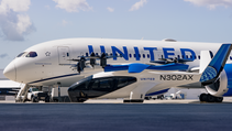 Archer Midnight sitting in front of United Airlines plane