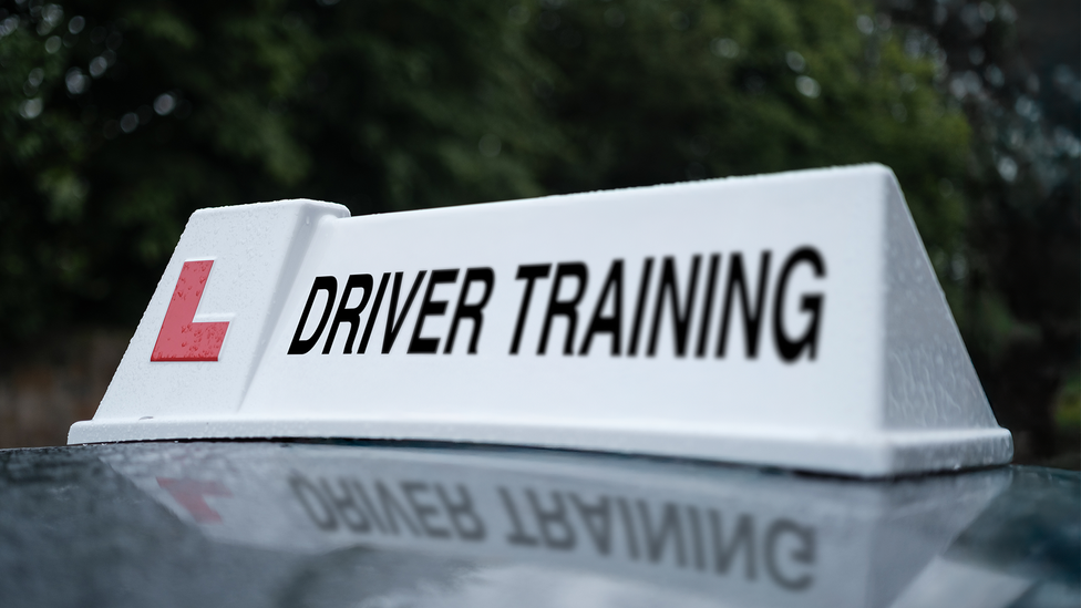 Close up of a learner 'driving training' sign for a car roof