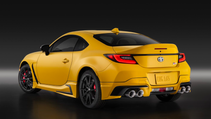 Rear three-quarter static shot of Toyota GR86 Yuzu Edition, a bright yellow sports car
