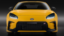 Front static shot of Toyota GR86 Yuzu Edition, a bright yellow sports car
