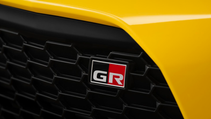 Close up exterior shot of Toyota GR86 Yuzu Edition front grille badge