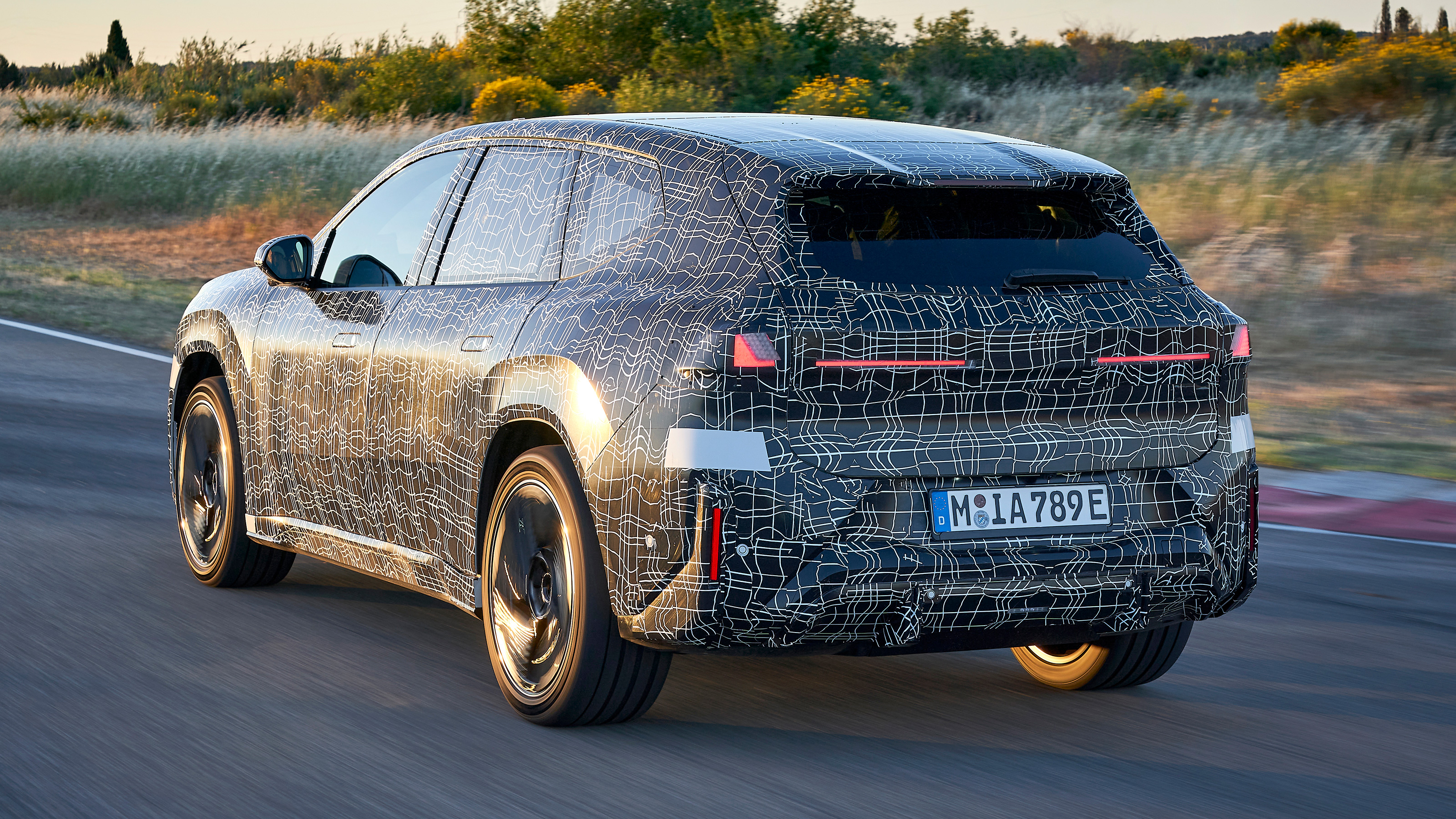 BMW iX3 prototype exterior rear three quarter dynamic