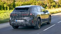 BMW iX3 prototype exterior rear three quarter dynamic