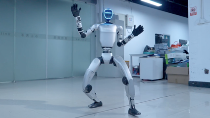 Frame of Unitech's G1 humanoid robot dancing with gloves and shoes on