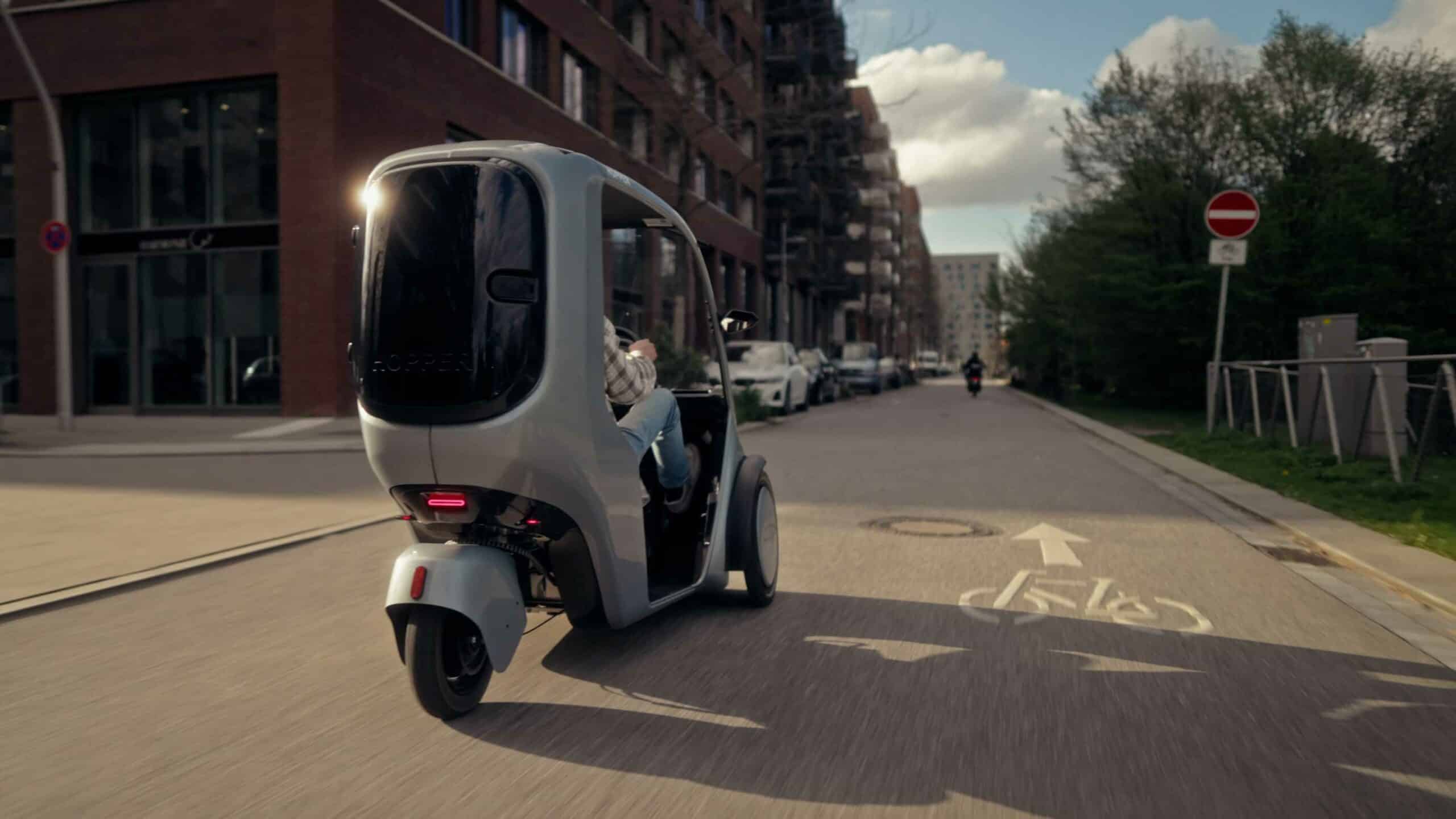 Driving shot of the Hopper e-Bike (covered trike) on a German road