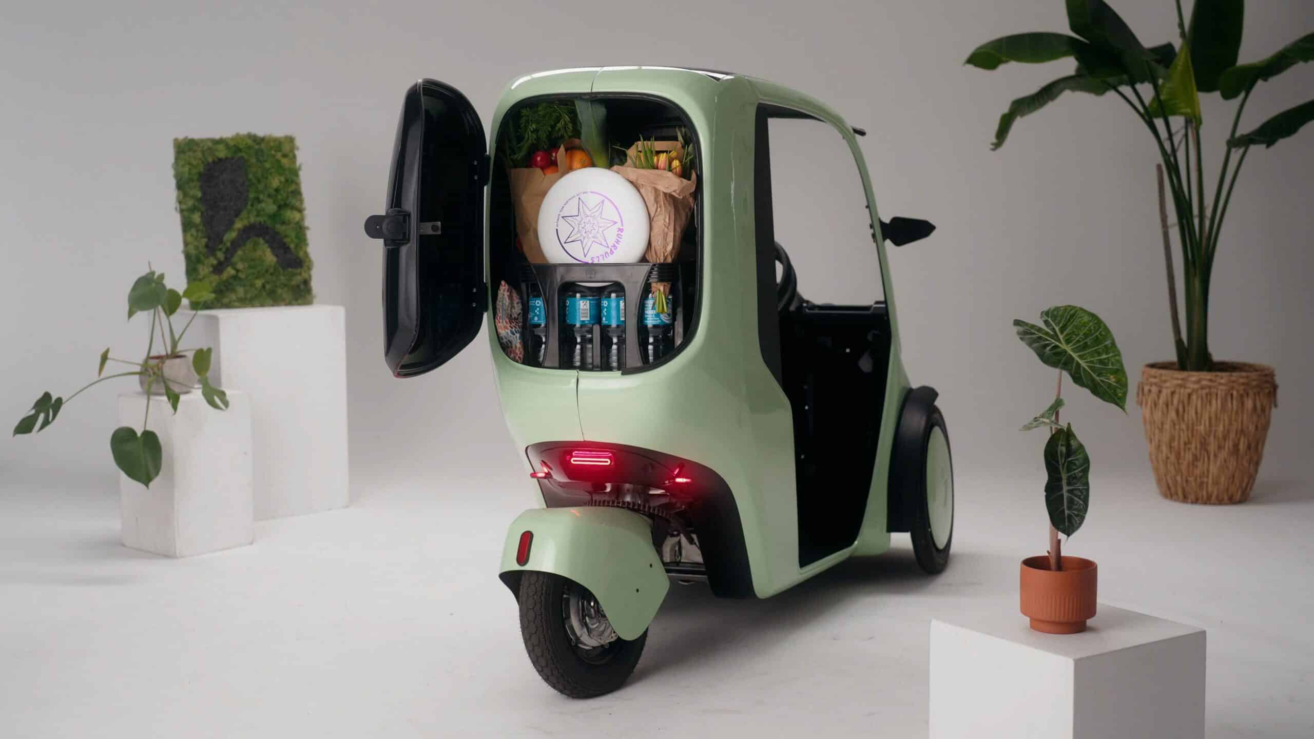 Studio shot of a Hopper e-Bike (covered trike) from the rear showing the cargo space