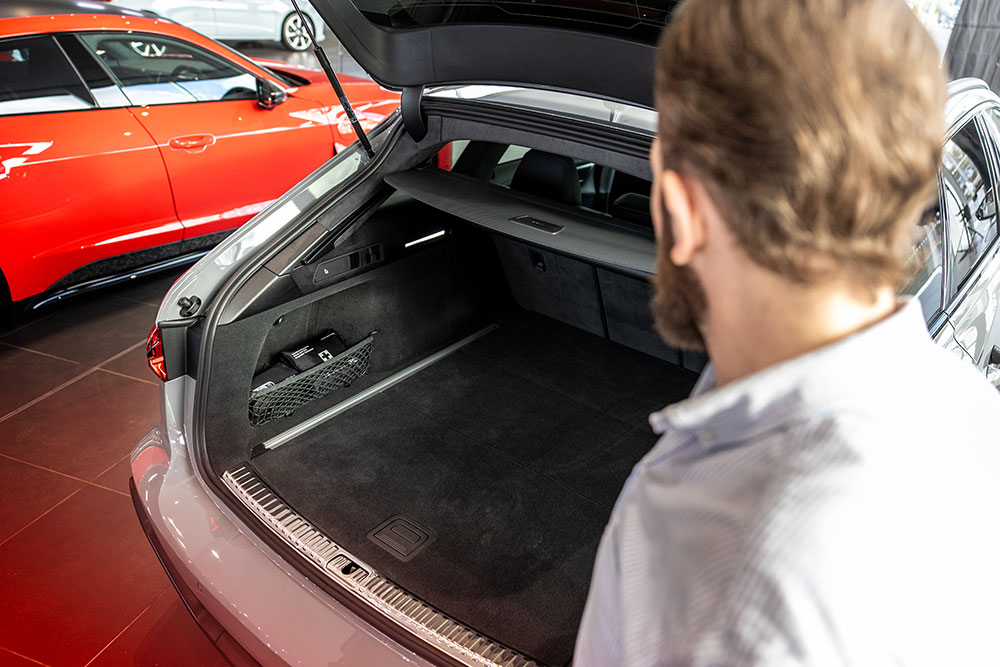 A man looking into the boot of an Audi RS