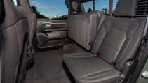 Interior of RAM 1500 showing the back seats with one seat folded away