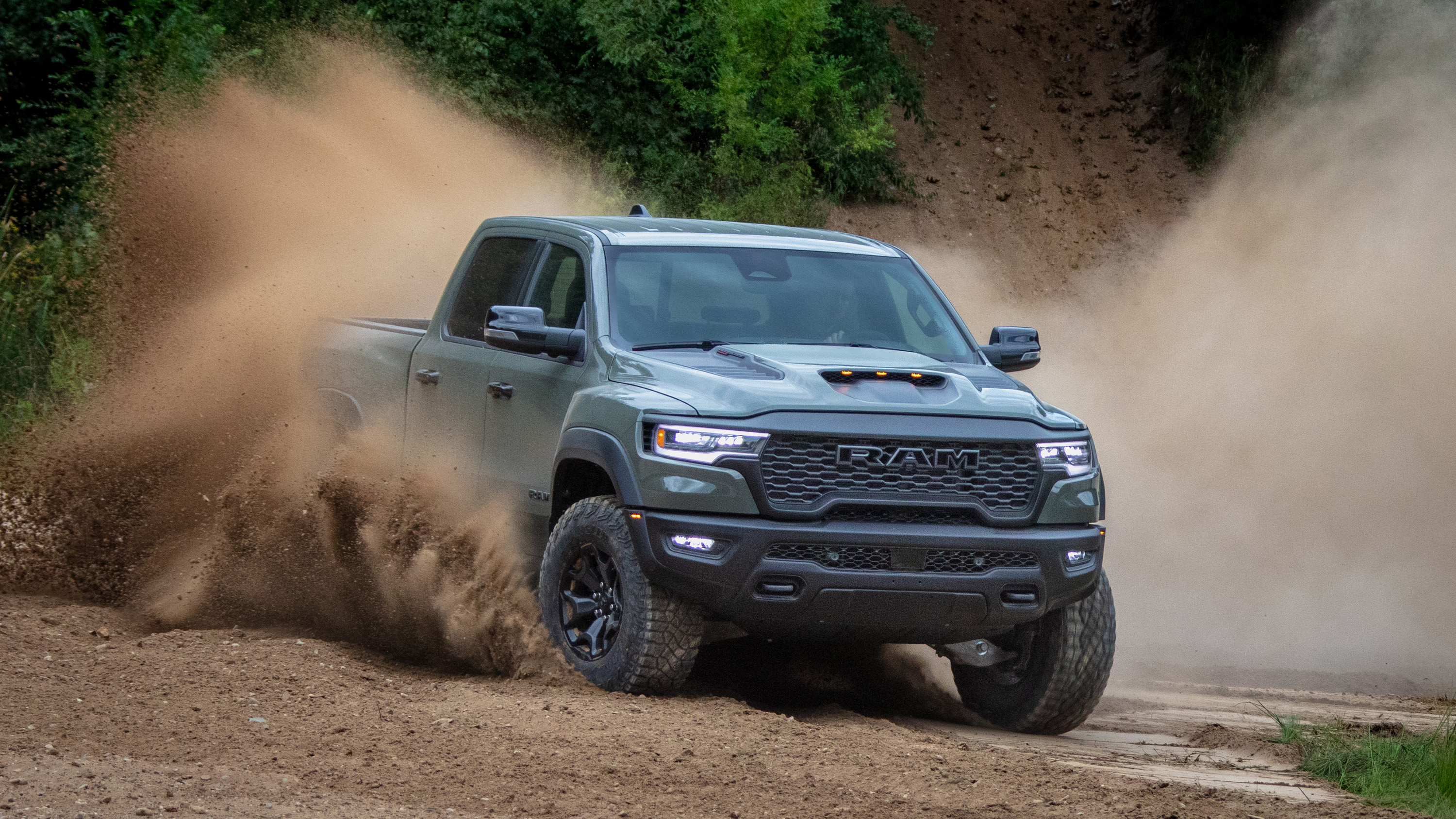 Action shot of RAM 1500 driving on a dirt road