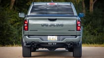 RAM 1500 pictured from behind with greenery in the background