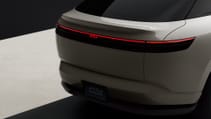 The rear of a light-coloured Afeela car is shown, with a thin red light spanning the width, and the Afeela logo in the centre..
