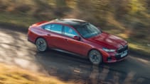 BMW 550e driving along a road, taken from above