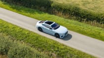 Bentley Continental GT Mulliner driving along a rural road
