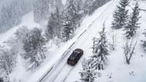 Cupra Leon Estate VZ1 pictured from the sky driving through the snow