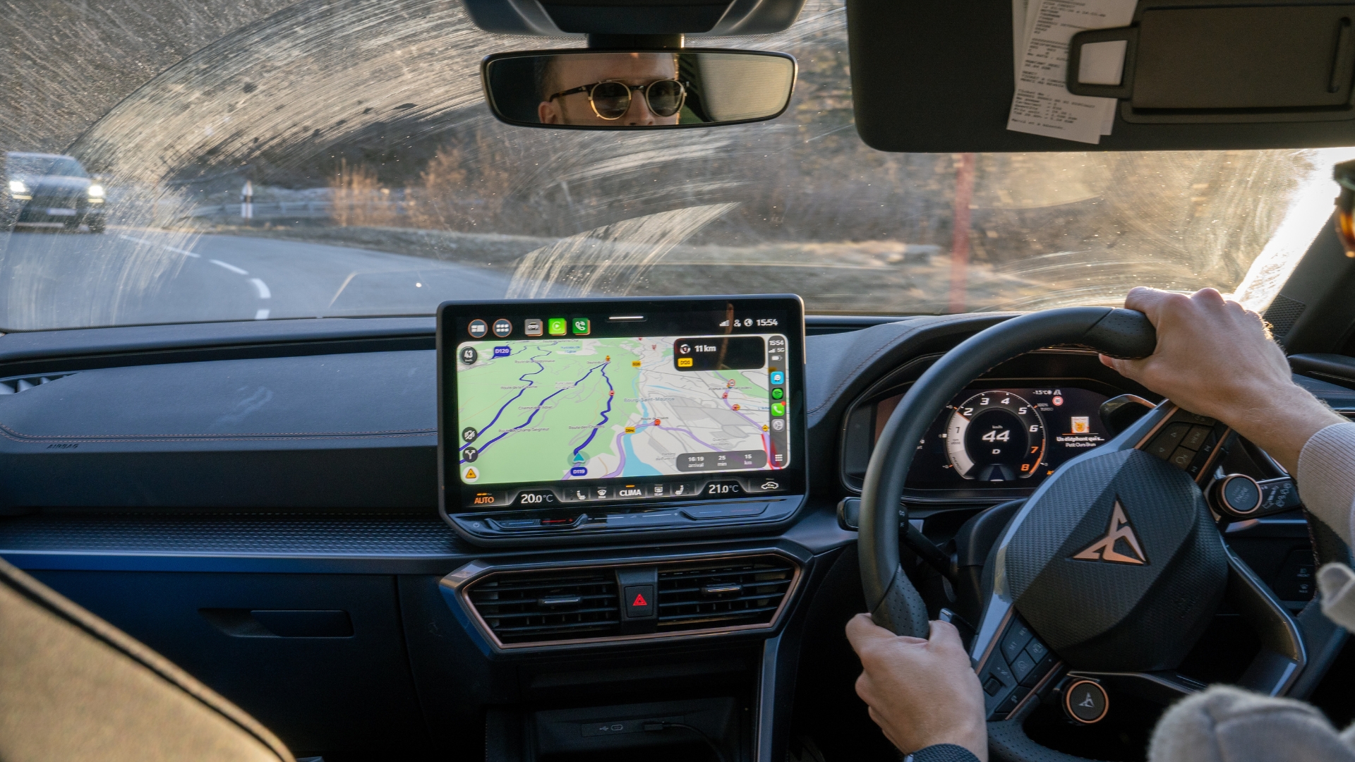 Cupra Leon Estate VZ1 interior showing drivers hands, central screen and the road ahead through the windshield
